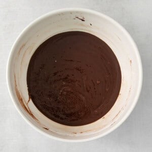 chocolate ganache in a white bowl.