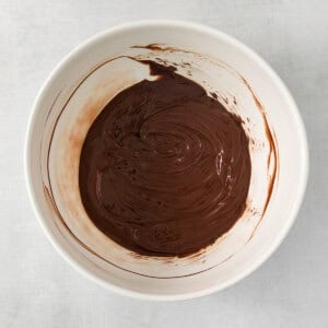 chocolate ganache in a white bowl.
