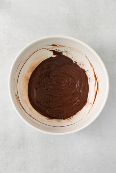 chocolate ganache in a white bowl.