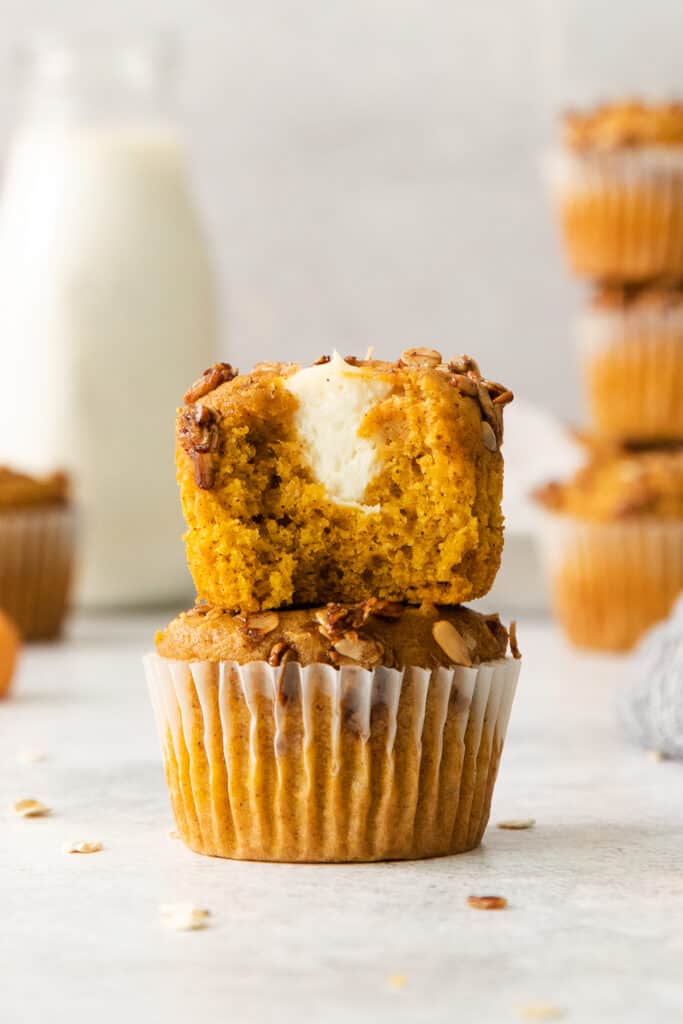 pumpkin muffins with a bite taken out of them.
