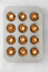a muffin tin filled with chocolate cupcakes.
