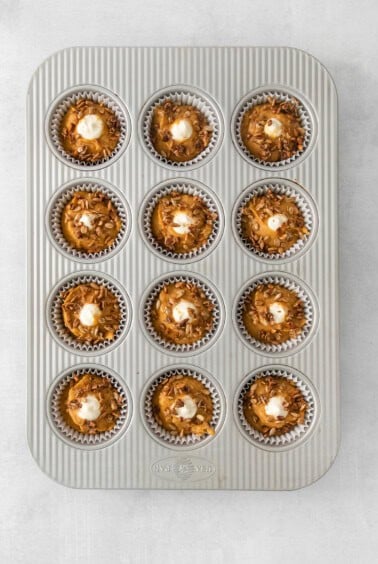 a muffin tin filled with chocolate cupcakes.