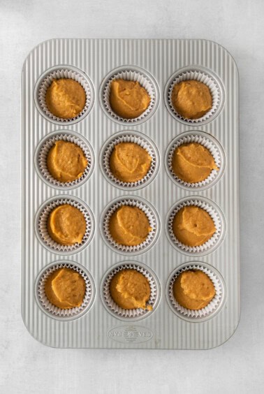 pumpkin muffins in a muffin tin.