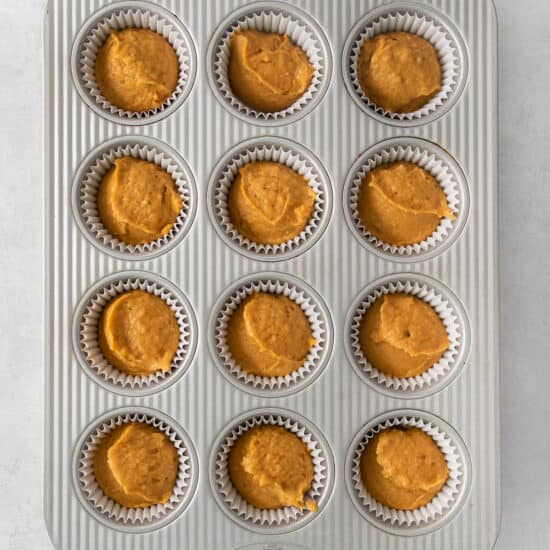 pumpkin muffins in a muffin tin.