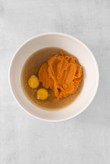 a bowl with mashed sweet potato and eggs in it.