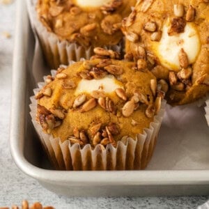 pumpkin buttermilk muffins in a pan with pecans.