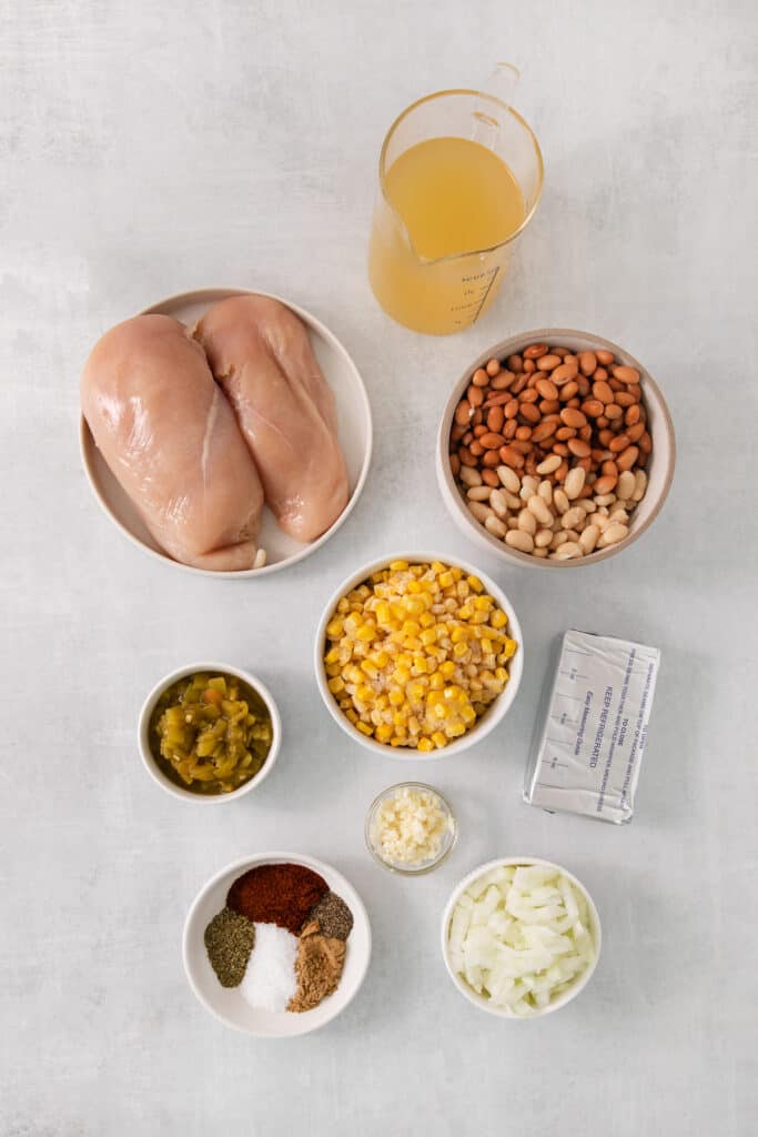 the ingredients for a chicken fajita dish are laid out on a table.