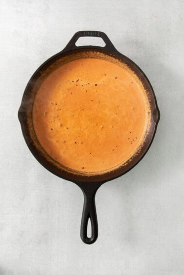 a cast iron skillet on a white background.