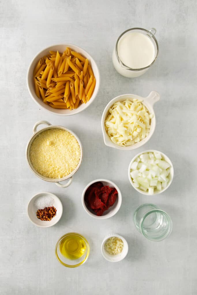 a table topped with bowls filled with different types of food.