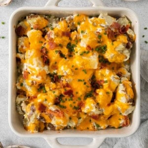 cheesy potato casserole in a casserole dish.