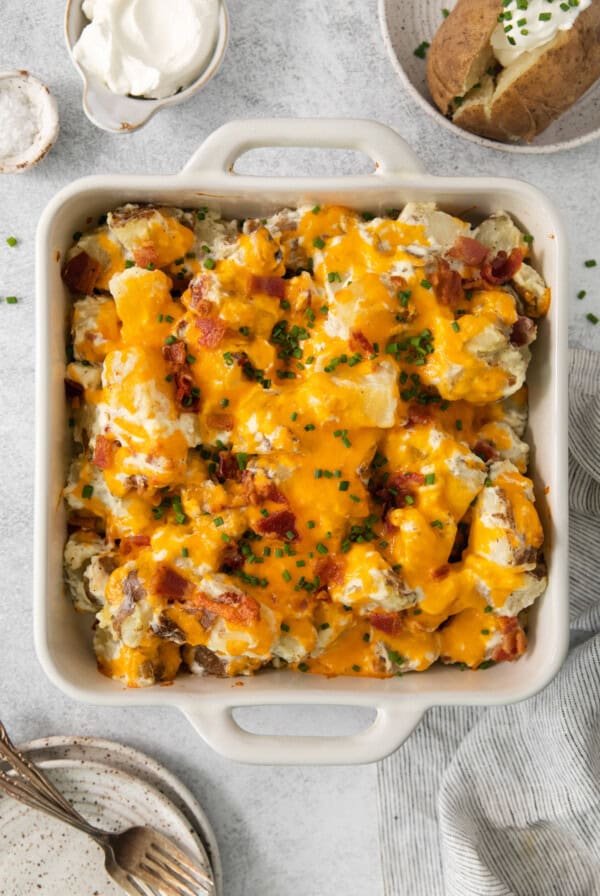 cheesy potato casserole in a casserole dish.