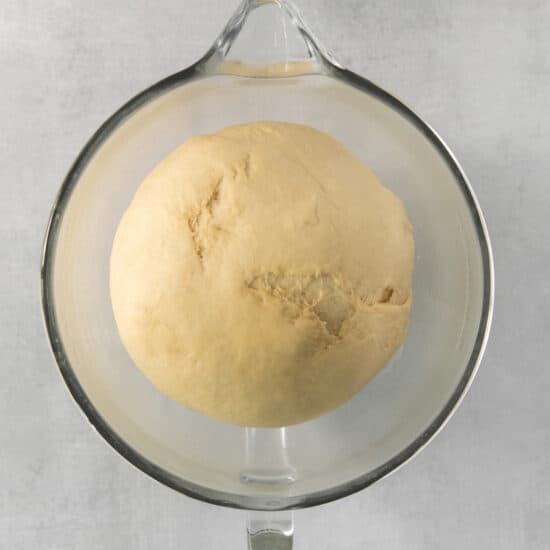 a ball of bread in a glass bowl.