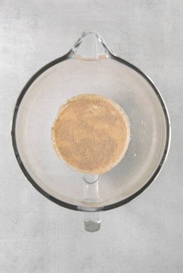 a glass bowl with a brown substance inside of it.