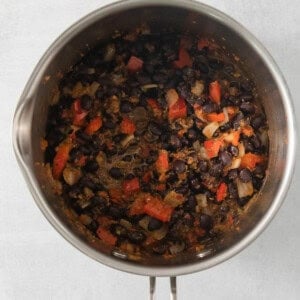 a pot filled with lots of food on top of a stove.