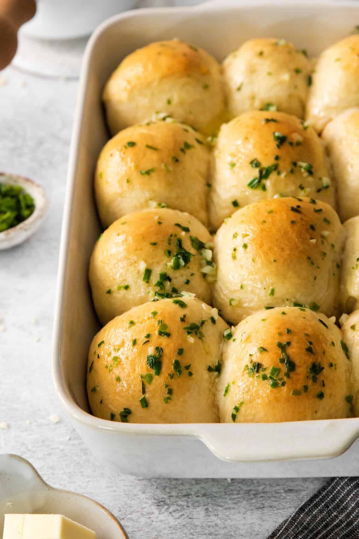 cheesy garlic rolls in a baking dish.