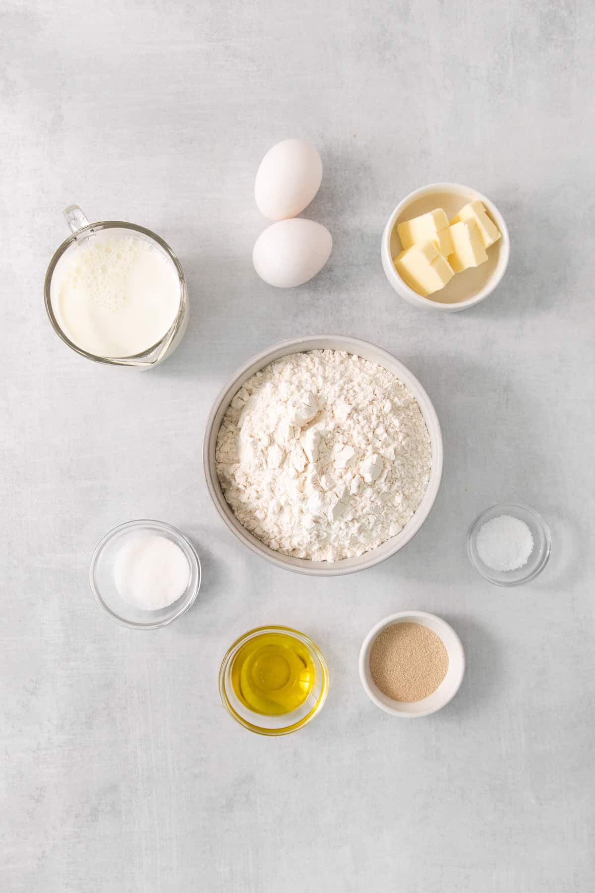 ingredients for baking a cake on a gray background.