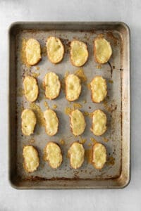 cheesy croutons on a baking sheet.