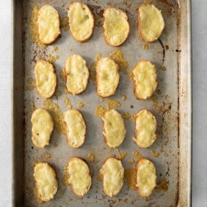 cheesy croutons on a baking sheet.