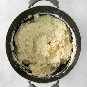 Mashed potatoes in a pan on a white background.