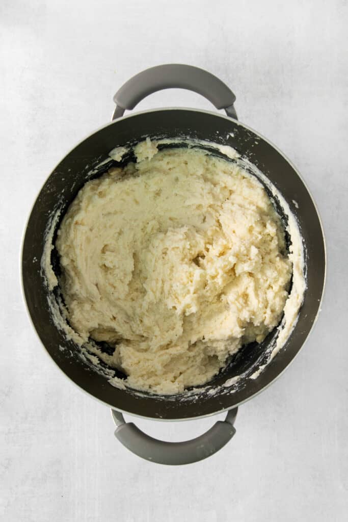 Mashed potatoes in a pan on a white background.