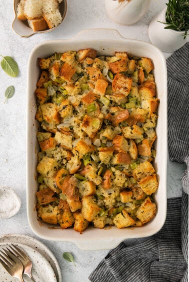 Bread stuffing in a white dish on a table.