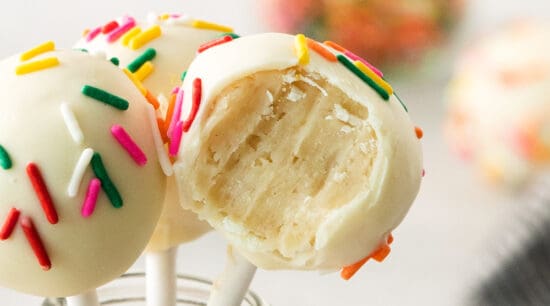cake pops with sprinkles on a stick.