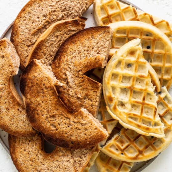 Waffles on a plate on a white background.