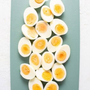 Hard boiled eggs on a cutting board.