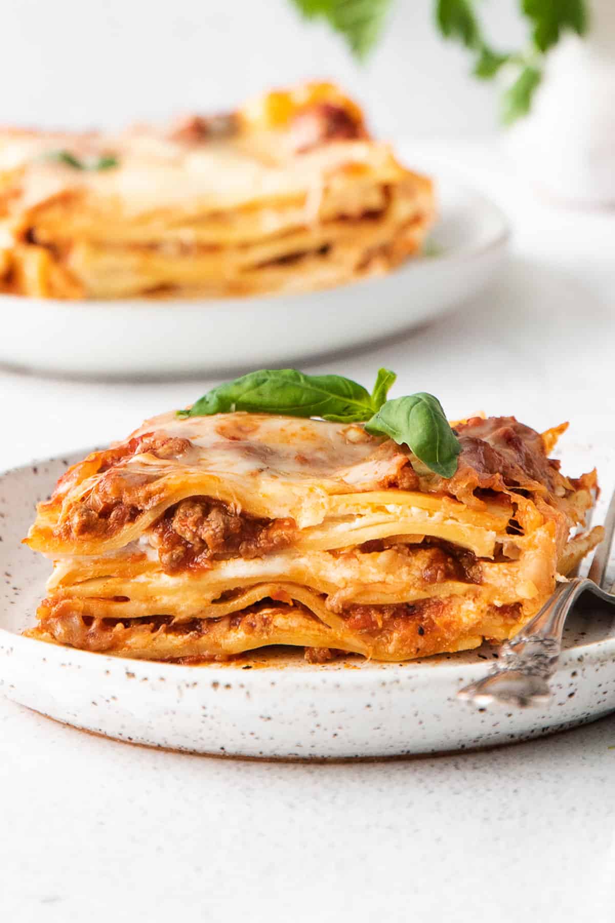 Lasagna on a plate with a fork.