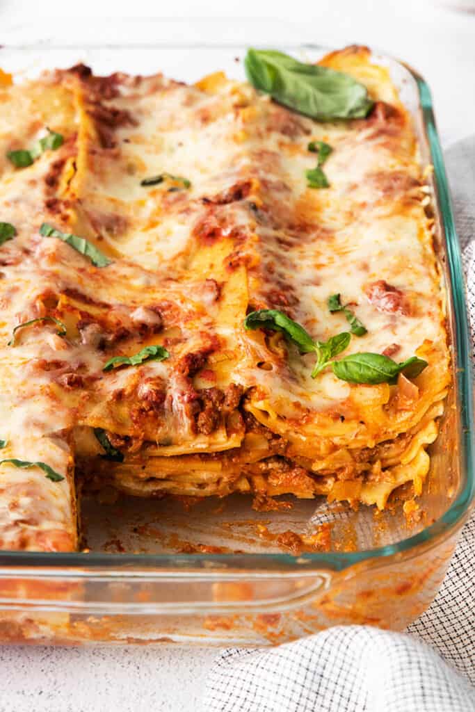 Lasagna in a glass baking dish.