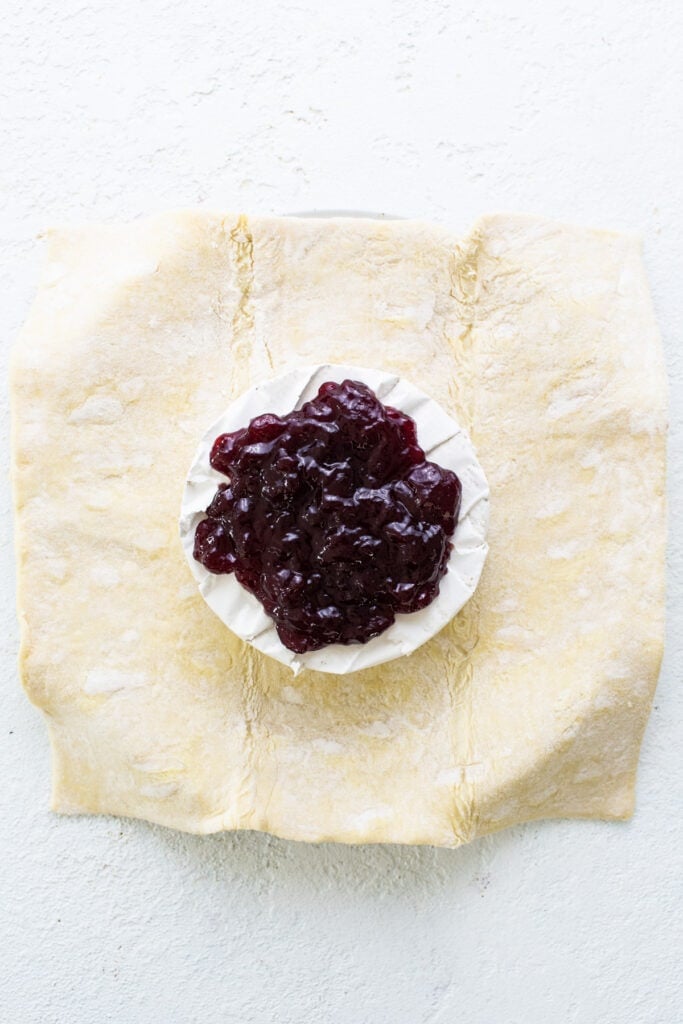 A pastry with jam on top of it.