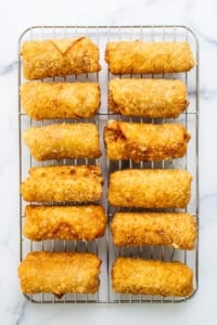 Fried calamari on a cooling rack.