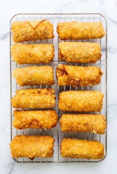 Fried calamari on a cooling rack.