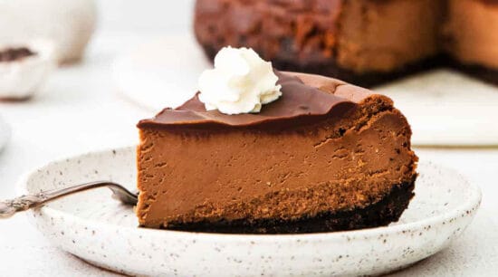 A slice of chocolate cheesecake on a plate.
