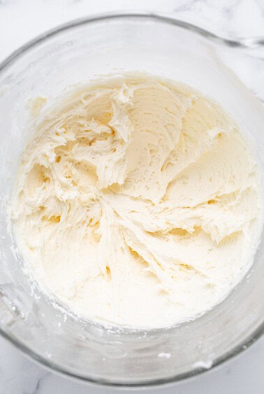 Whipped cream in a glass bowl.