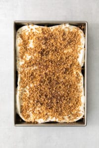 A cake in a metal pan with a crumb topping.