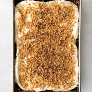 A cake in a metal pan with a crumb topping.