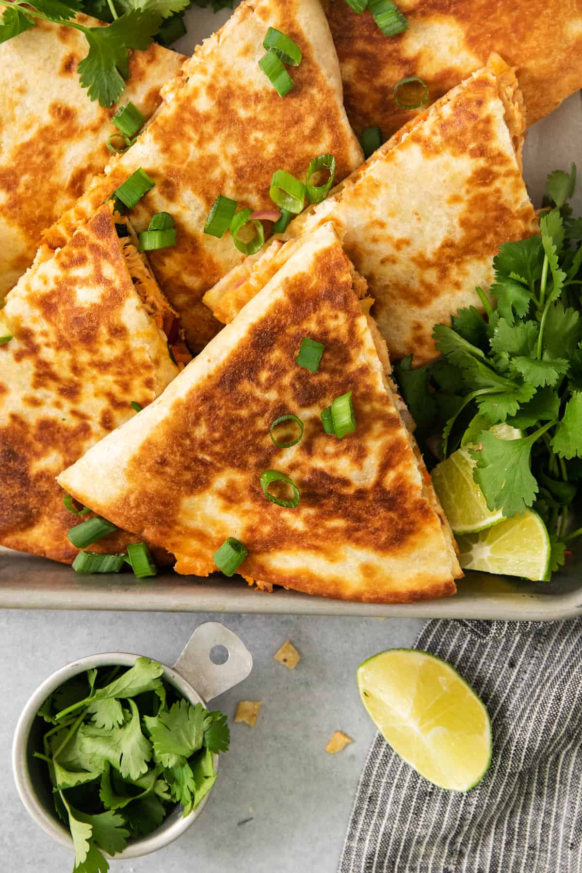 Chicken quesadillas on a baking sheet.