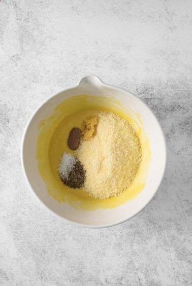 A white bowl with ingredients in it.