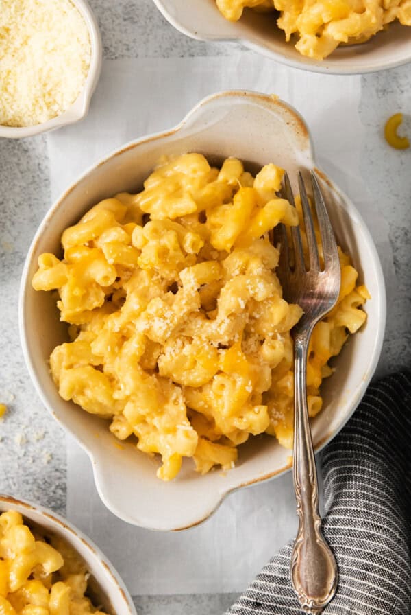 Macaroni and cheese in a bowl with a fork.