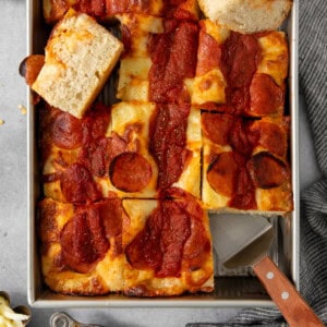 Pepperoni pizza in a baking pan.