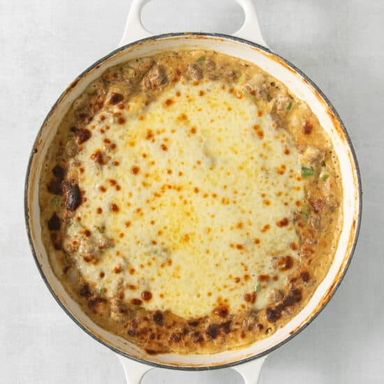 A casserole dish with cheese and meat in it.