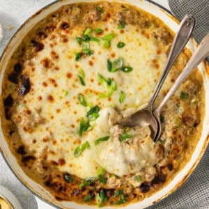 A casserole dish with cheese and meat in it.