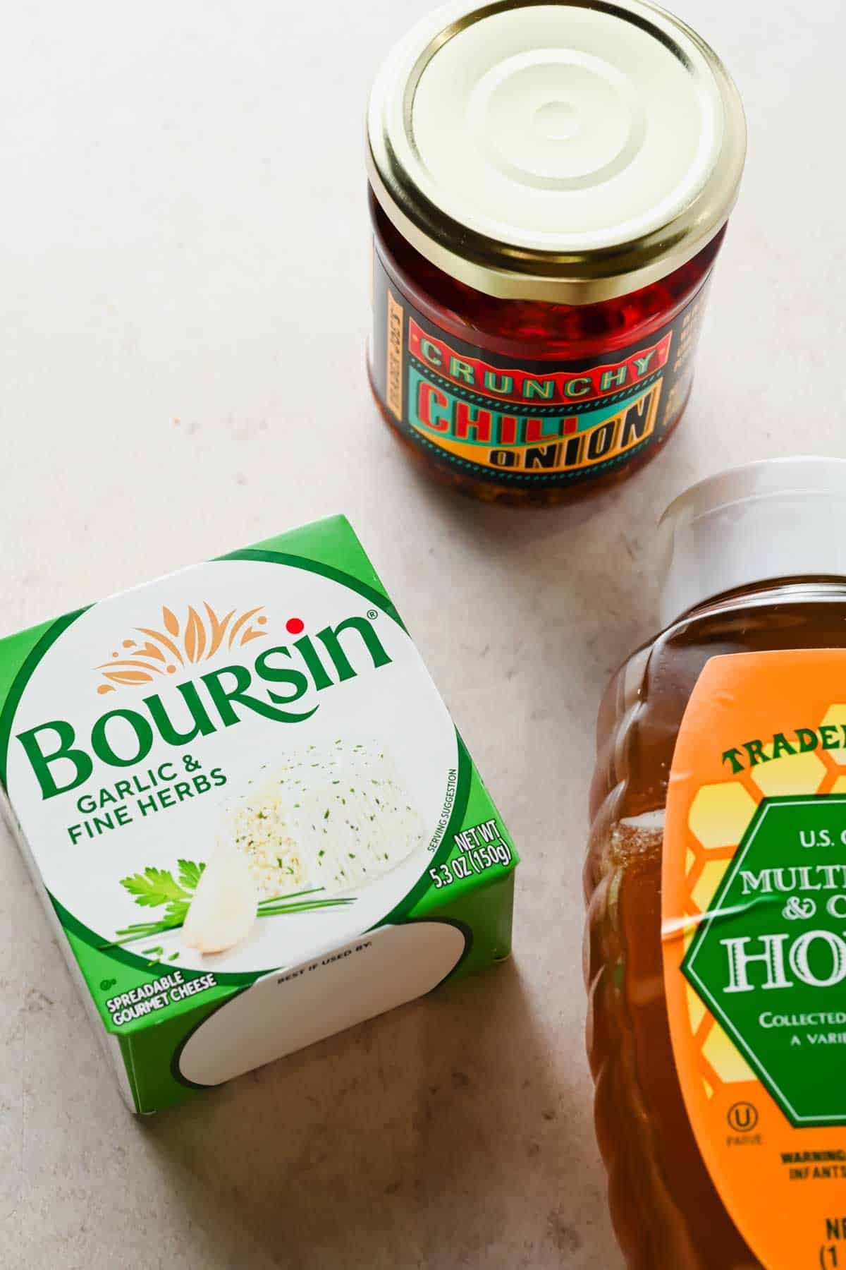 Boursin garlic and herb cheese, chili crunch, and honey — all 3 ingredients for boursin chili crunch dip