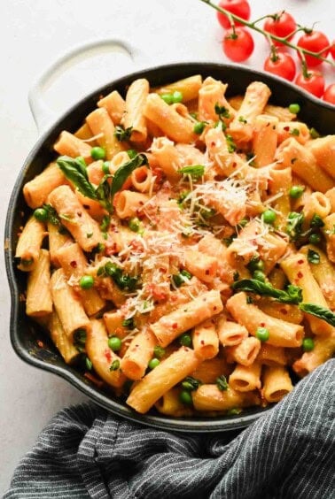 Creamy spicy cottage cheese pasta topped with Parmesan and basil