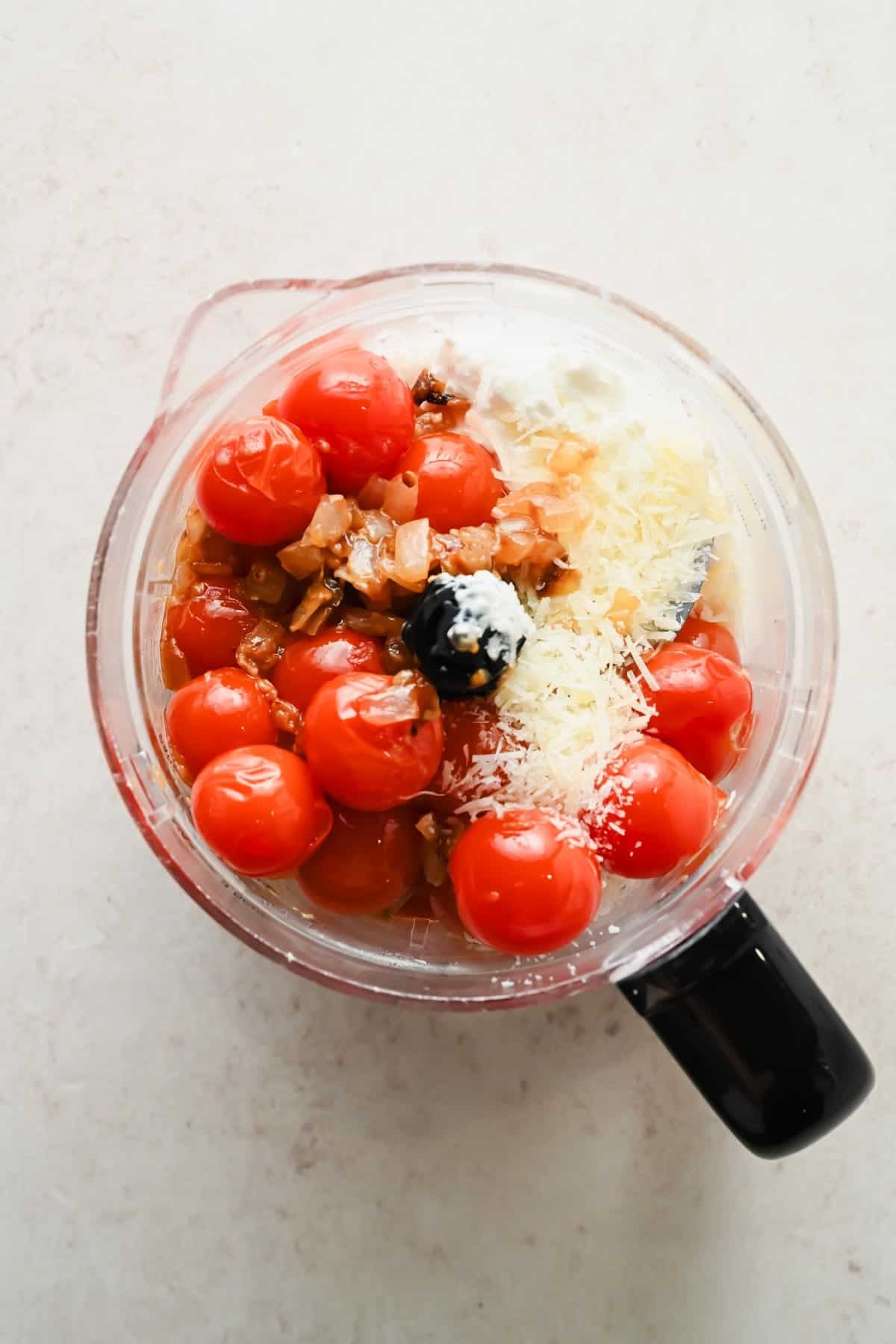 Tomatoes, cottage cheese, Parmesan, and red pepper flakes in a food processor