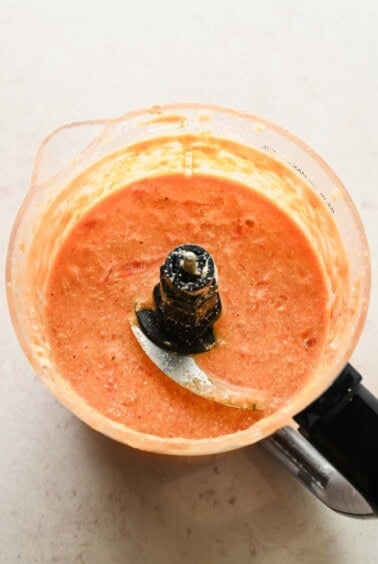 Smooth cottage cheese and tomato sauce in a food processor