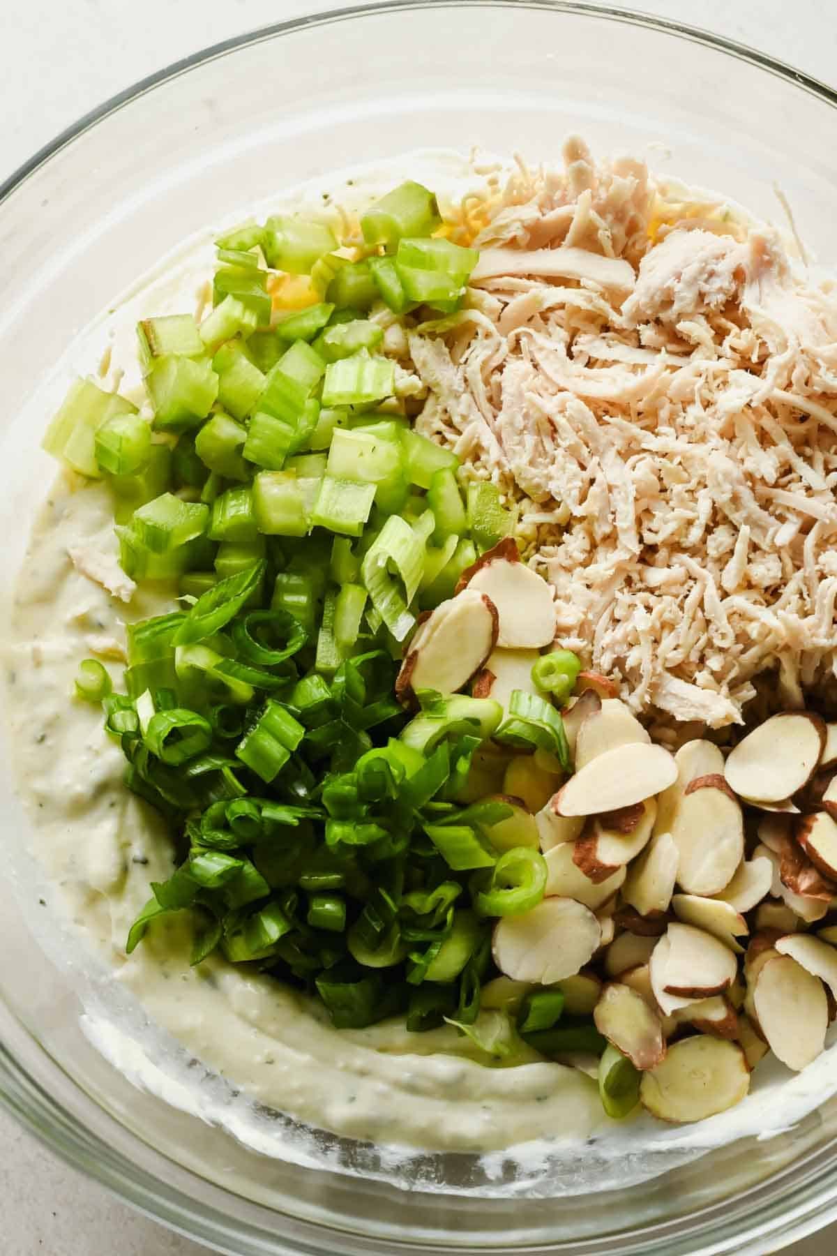 Cooked chicken, diced celery, green onions, and sliced almonds added to creamy Boursin dressing.