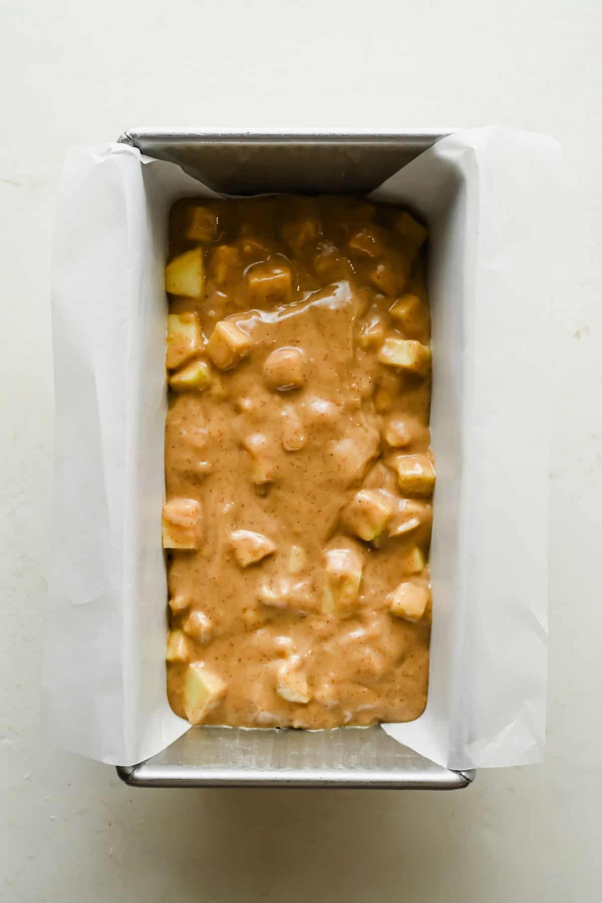 Remaining apple bread batter spread over the cream cheese filling