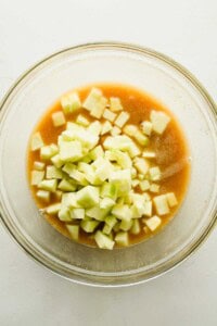 Diced Granny Smith apples added to the wet ingredients for apple fritter bread